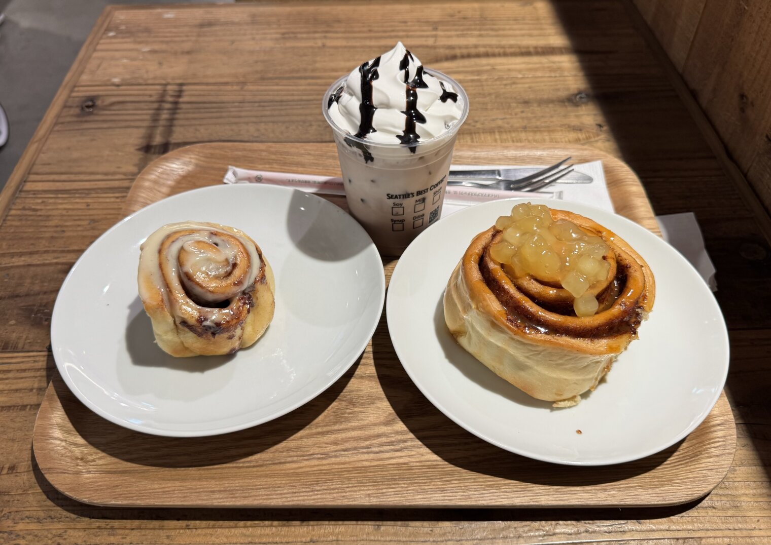 two cinnabons and an iced coffee, awaiting consumption.