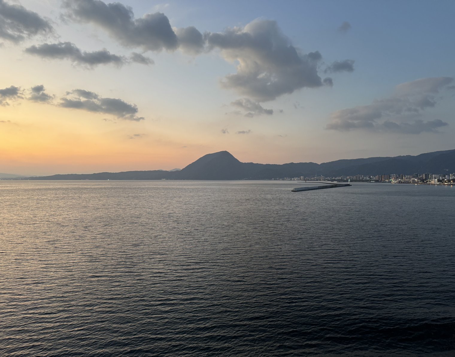 Beppu at sunrise as viewed from a ferry heading into port